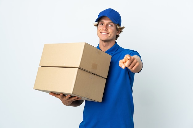 Delivery man over isolated white pointing front with happy expression