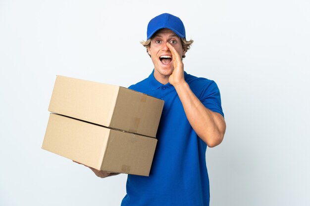 Photo delivery man over isolated white shouting with mouth wide open