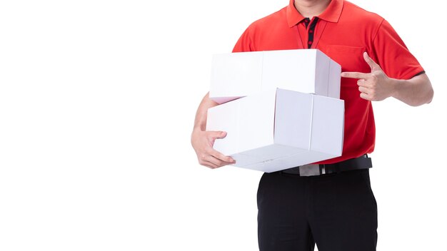 Delivery man pointing at parcels isolated on white