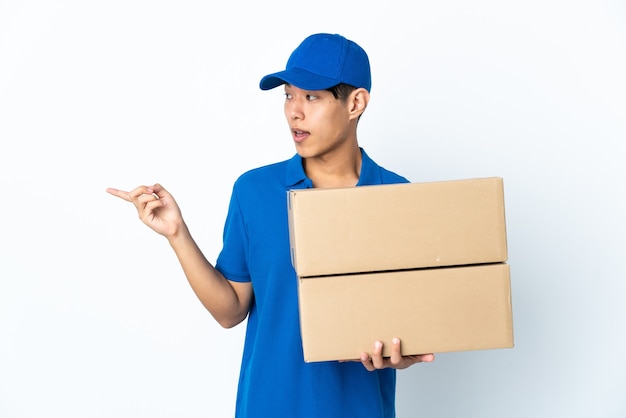 Delivery man posing isolated against the blank wall