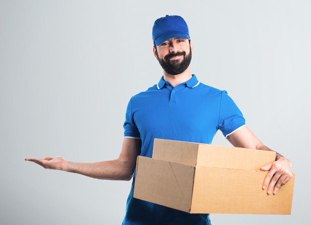 Delivery man presenting something
