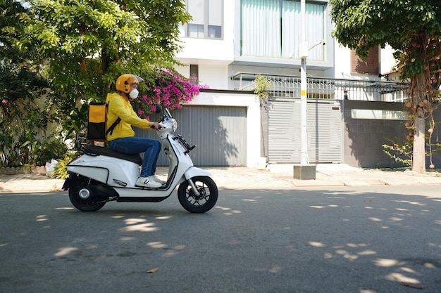 Delivery man riding motorbike