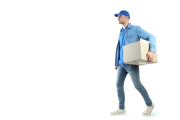 Delivery man walking with a box, isolated on white background