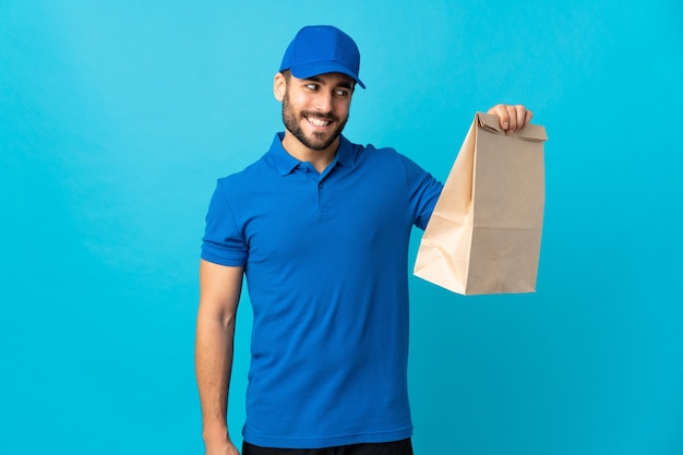 Delivery man with beard in studio