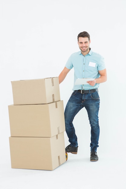 Delivery man with cardboard boxes