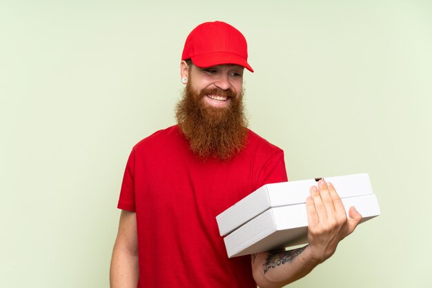 Delivery man with long beard with happy expression