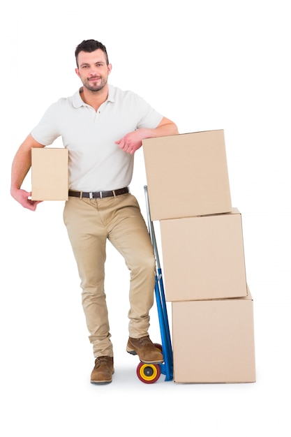 Delivery man with trolley of boxes