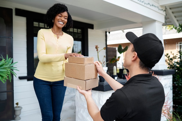 Photo delivery person getting parcel out for delivery