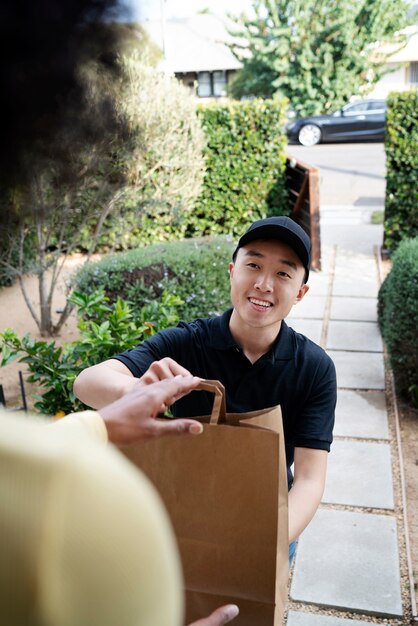 Delivery person getting parcel out for delivery