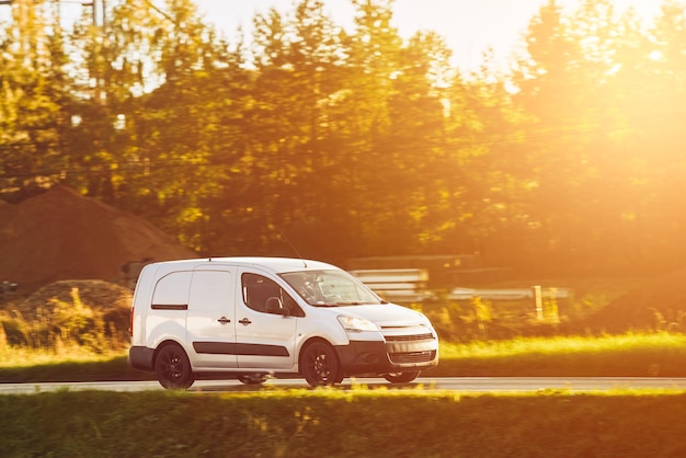 On the Delivery Route Commercial Van CloseUp on the Road Logistics branding Commercial van on the road Final destination shipping truck mockup