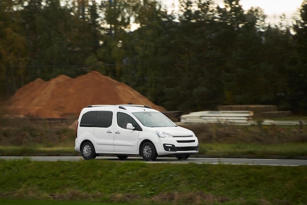 On the Delivery Route Commercial Van CloseUp on the Road Logistics branding Commercial van on the road Final destination shipping truck mockup