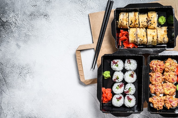 Delivery service Japanese food rolls in box.