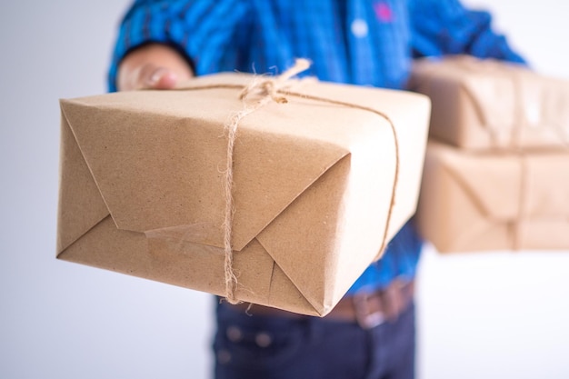 The delivery staff file a parcel box for customers who order products online Online delivery