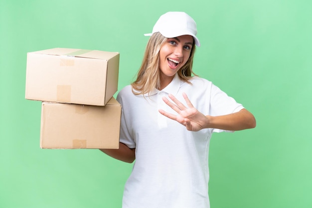 Delivery Uruguayan woman over isolated background happy and counting four with fingers