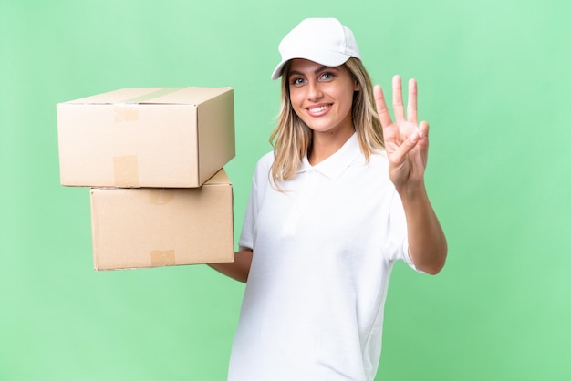 Delivery Uruguayan woman over isolated background happy and counting three with fingers