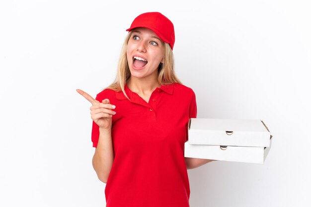 Delivery woman holding pizzas isolated on white background intending to realizes the solution while lifting a finger up