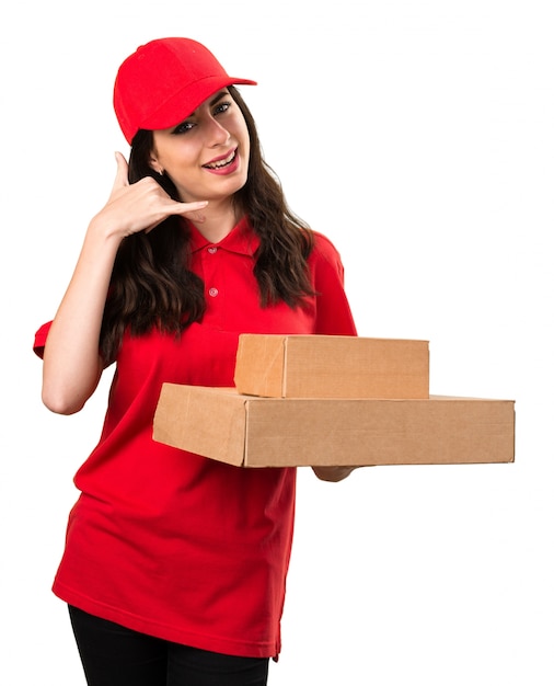 Delivery woman making phone gesture