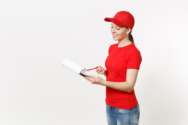 Delivery woman in red uniform isolated on white background. Female in cap, t-shirt, jeans working as courier or dealer, holding pen, clipboard with papers document, with blank empty sheet. Copy space.