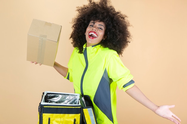 Delivery woman, with backpack, beige background