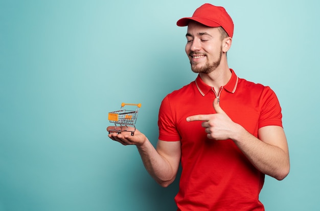 Deliveryman shows the cart where to buy