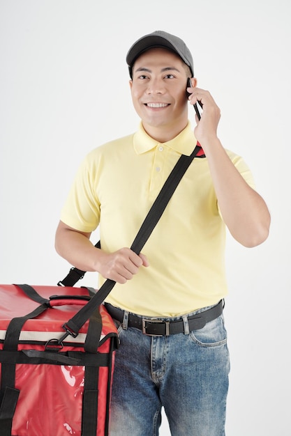 Deliveryman Talking on Phone with Cutomer