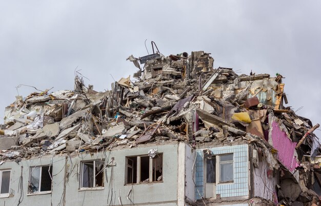 Demolition of buildings in urban environments. House in ruins.