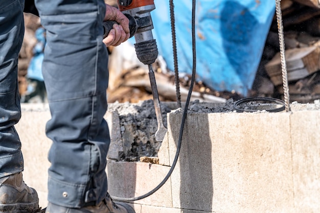 Demolition of concrete with an electric hammer