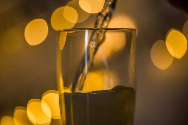 Den helder netherlands december 2022 a glass of champagne on a goloden background