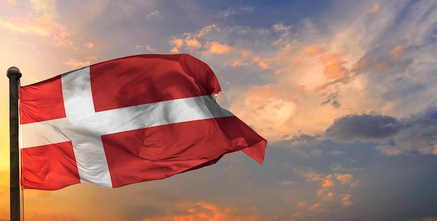 The denark waving flag and sky background.