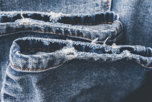 Denim blue jeans textuur met slijtage en gaten