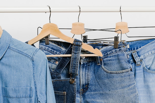 Denim clothes on hangers