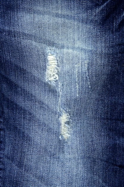 Struttura del tessuto rotta delle blue jeans di modo del denim