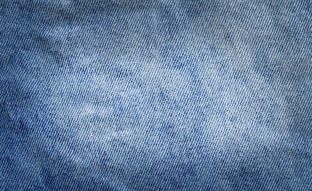 Denim jeans background. Old grunge vintage denim jeans