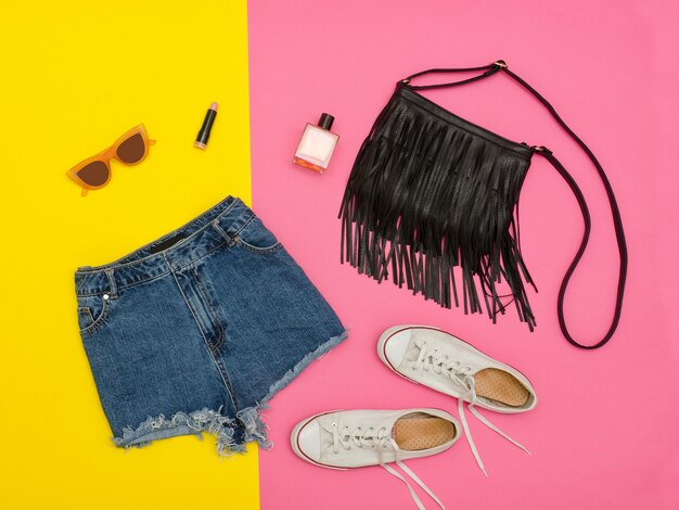 Denim shorts, white sneakers, handbag and glasses