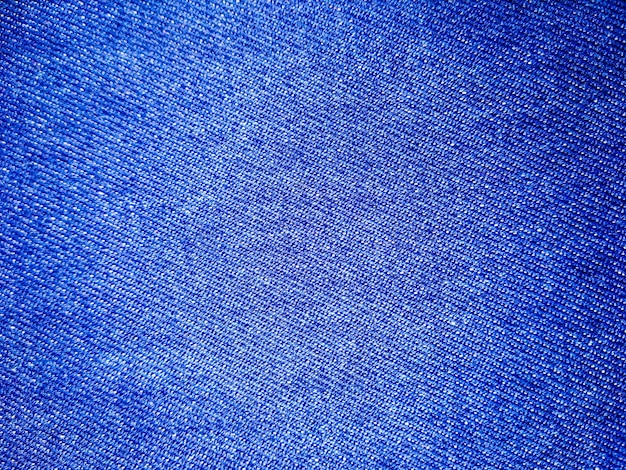 denim texture and detail of blue jeans closeup textured background