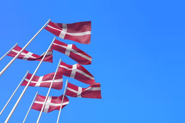 Denmark flags waving in the wind against a blue sky d rendering