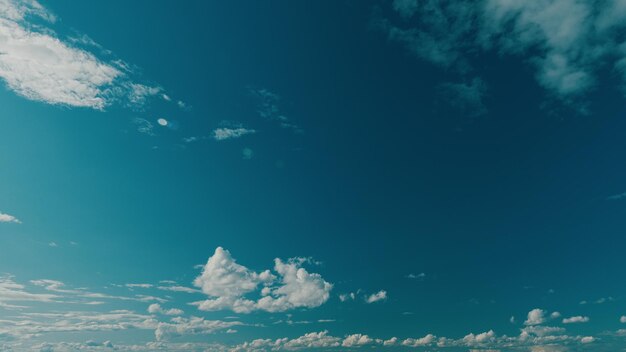 Dense cumulus clouds on a clear blue sky white clouds in blue sky picturesque view of blue sky with