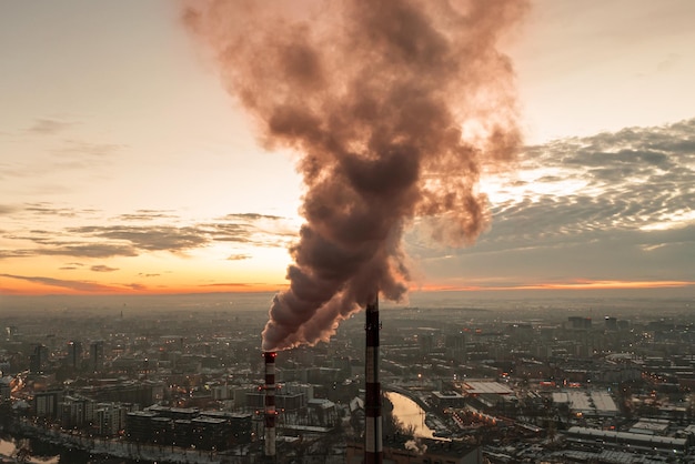 Dense smoke from a thermal power plant over residential areas of the city drone view Wroclaw Poland