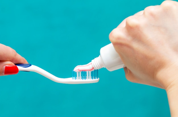 Photo dental care, oral care products close-up on a light green