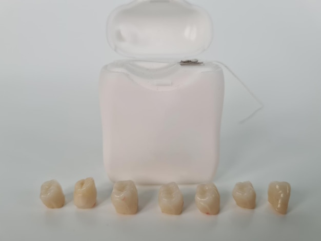 Dental care and tooth with caries Teeth model with dental floss