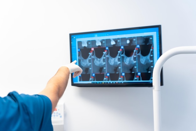 Dental clinic routine annual medical checkup of a young woman looking at the xray