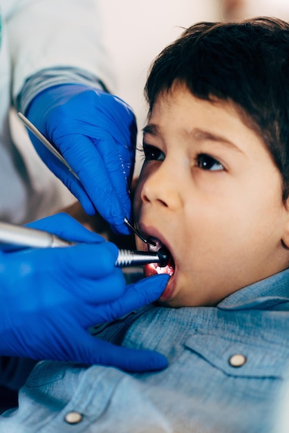 Dental drilling little boy's tooth