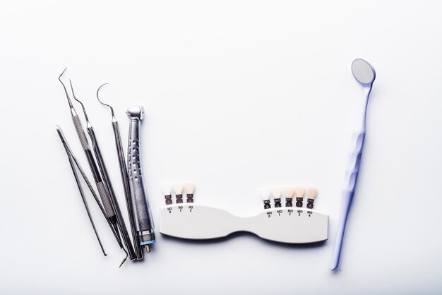 Photo dental equipment on white table with copy space