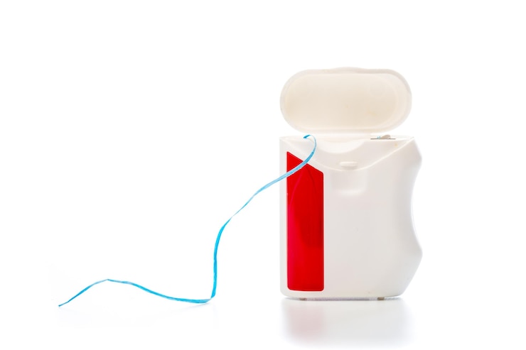 Photo dental floss on an isolated background