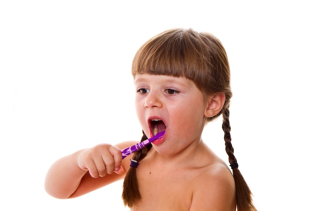 Dental hygiene. happy little girl brushing her teeth