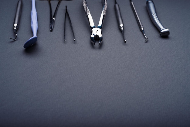 Dental instruments composed on gray background with copy space