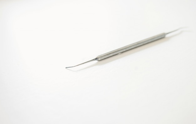 Dental instruments on white background