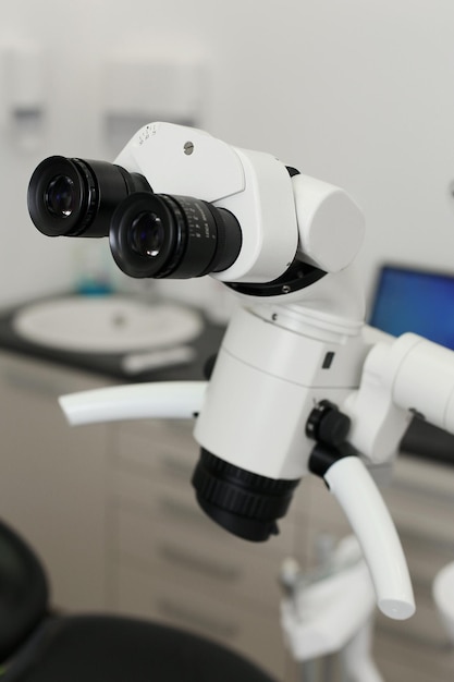 dental microscope in a dental office photographed on a white background