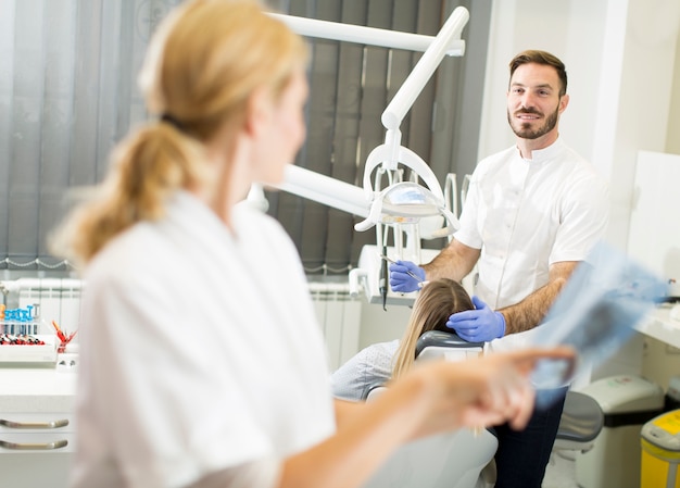 Dental specialist examine an x-ray of the tooth