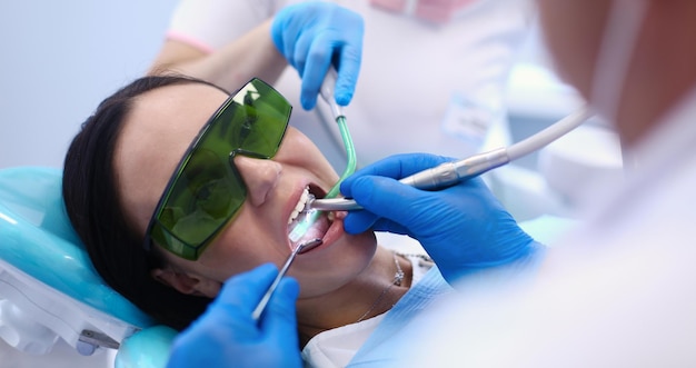 Dental team and patient at dentist's surgery